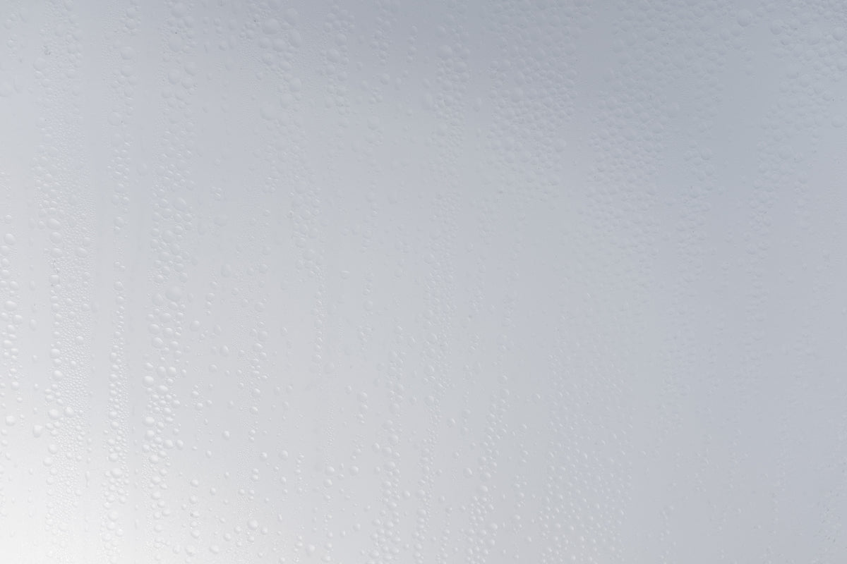 a white wall with water drops on it
