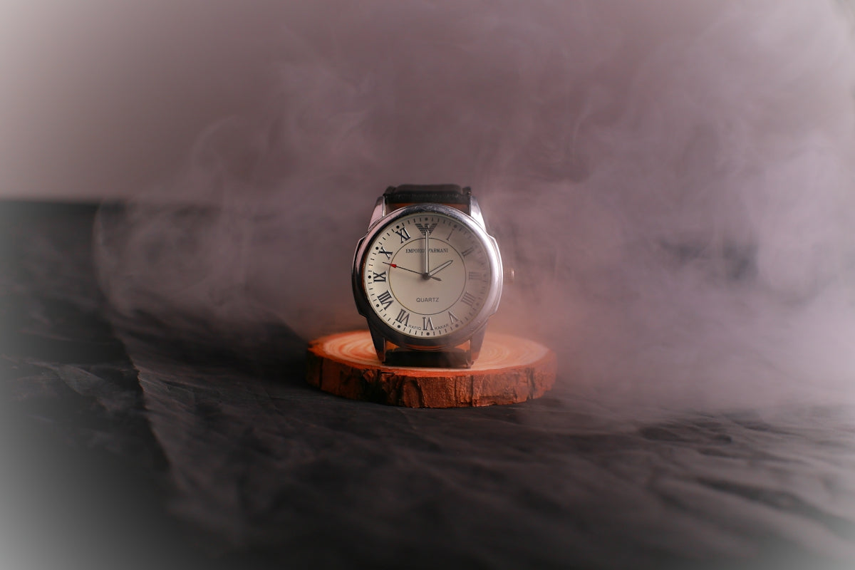 a clock sitting on top of a wooden stand