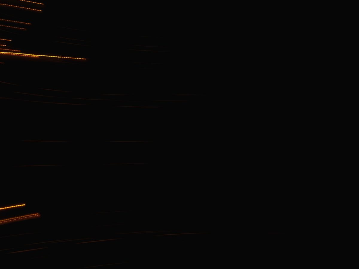 Streaks of light against a dark background